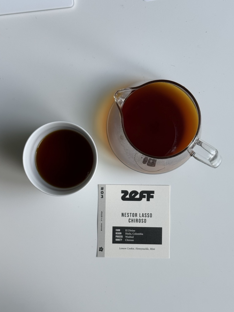 A ZEFF coffee — cup and pitcher with its feature card